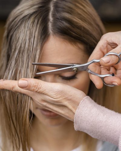 front-view-woman-getting-haircut