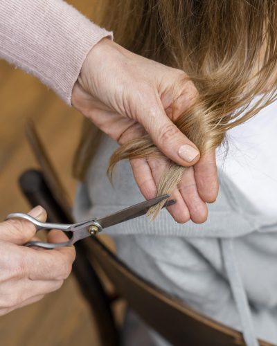 high-angle-woman-getting-haircut