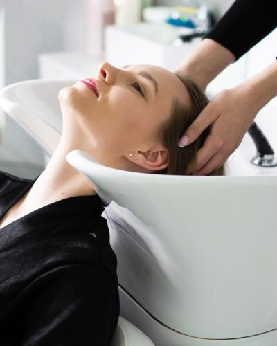 Young woman at hair salon